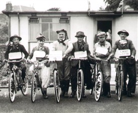 Photo:Fancy dress bicycle competition in front of prefabs at Preston Park, Linlithgow, 1950s.