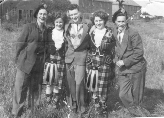 Photo:Matt, Alex and James Morris, with Highland dancers at the 1953 gala day.