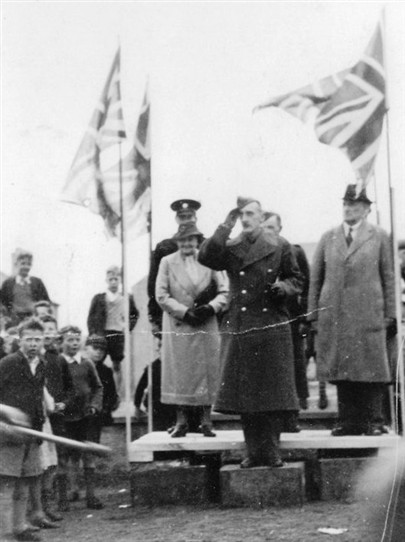 Photo:Ma Moore takes the salute at a wartime or victory parade.