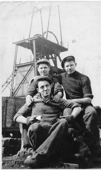Photo:John Kelly (front), with Allan Mark and Tommy Curran, pithead workers at Loganlea Colliery, 1953.