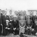 Photo:Loganlea Gala Day Committee 1949 in front of the pre-fabs that were down from the present Post Office.